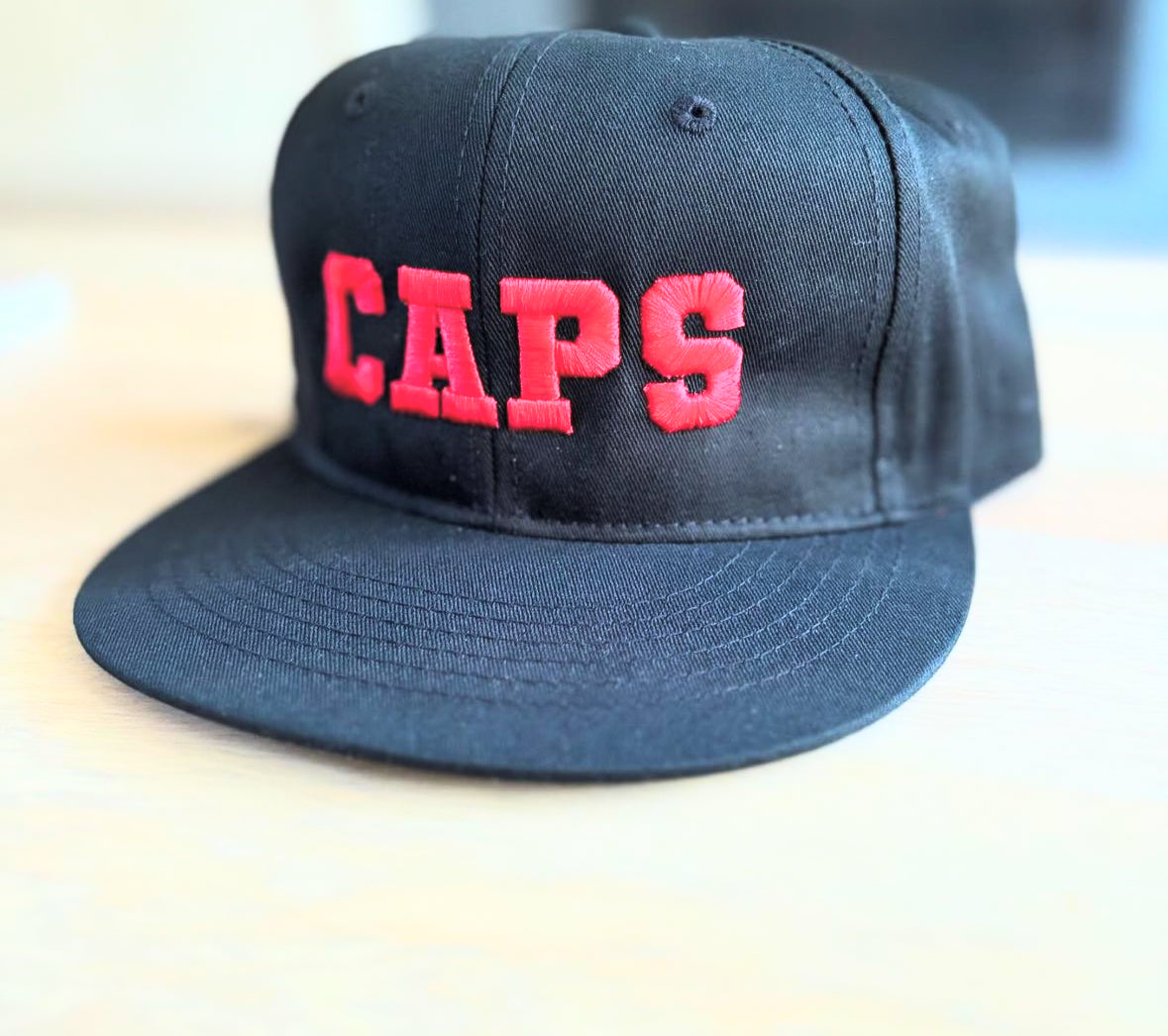 CAPS Snapback Hat